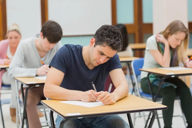 student writing IELTS exam